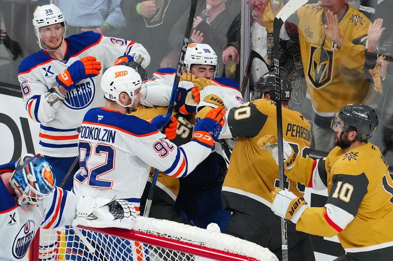 May 8, 2025; Las Vegas, Nevada, USA; Vegas Golden Knights players scrum with Edmonton Oilers players behind the Oilers net during the third period of game two of the second round of the 2025 Stanley Cup Playoffs at T-Mobile Arena. Mandatory Credit: Stephen R. Sylvanie-Imagn Images