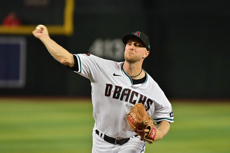 Sep 20, 2023; Phoenix, Arizona, USA;  Arizona Diamondbacks starting pitcher Merrill Kelly (29) throws in the first inning against the San Francisco Giants at Chase Field. Mandatory Credit: Matt Kartozian-USA TODAY Sports