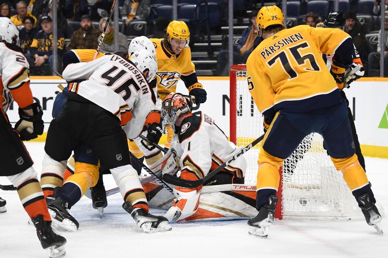 Jan 9, 2024; Nashville, Tennessee, USA; Nashville Predators right wing Denis Gurianov (15) scores a goal against Anaheim Ducks goaltender Lukas Dostal (1) during the third period at Bridgestone Arena. Mandatory Credit: Christopher Hanewinckel-USA TODAY Sports