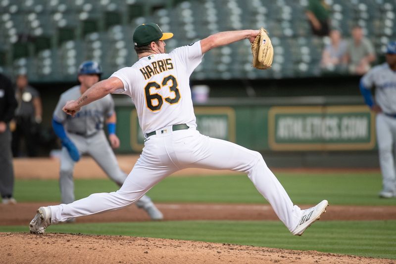 Aug 22, 2023; Oakland, California, USA; Oakland Athletics relief pitcher Hogan Harris (63) throws a pitch during the second inning against the Kansas City Royals at Oakland-Alameda County Coliseum. Mandatory Credit: Ed Szczepanski-USA TODAY Sports