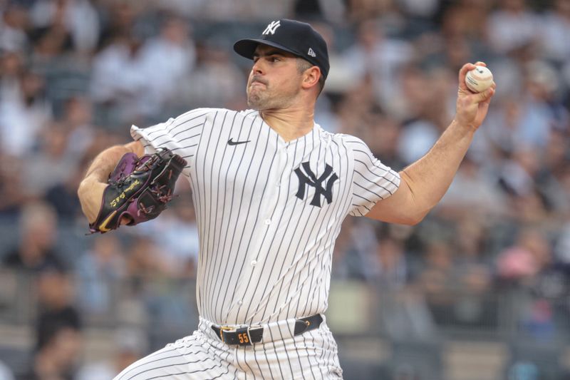 Jun 5, 2024; Bronx, New York, USA; New York Yankees starting pitcher Carlos Rodon (55) delivers a pitch during the first inning against the Minnesota Twins at Yankee Stadium. Mandatory Credit: Vincent Carchietta-USA TODAY Sports