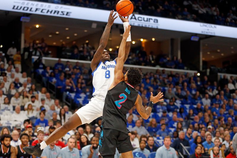 Feb 25, 2024; Memphis, Tennessee, USA; Memphis Tigers forward David Jones (8) shoots as Florida Atlantic Owls guard Nick Boyd (2) defend during the first half at FedExForum. Mandatory Credit: Petre Thomas-USA TODAY Sports