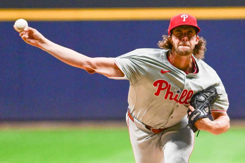 Sep 18, 2024; Milwaukee, Wisconsin, USA; Philadelphia Phillies starting pitcher Aaron Nola (27) pitches in the first inning against the Milwaukee Brewers at American Family Field. Mandatory Credit: Benny Sieu-Imagn Images