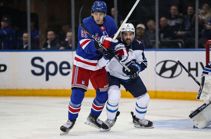 Mar 19, 2024; New York, New York, USA; New York Rangers center Alex Wennberg (91) battles Winnipeg Jets defenseman Dylan DeMelo (2) in front of the net during the first period at Madison Square Garden. Mandatory Credit: Danny Wild-USA TODAY Sports