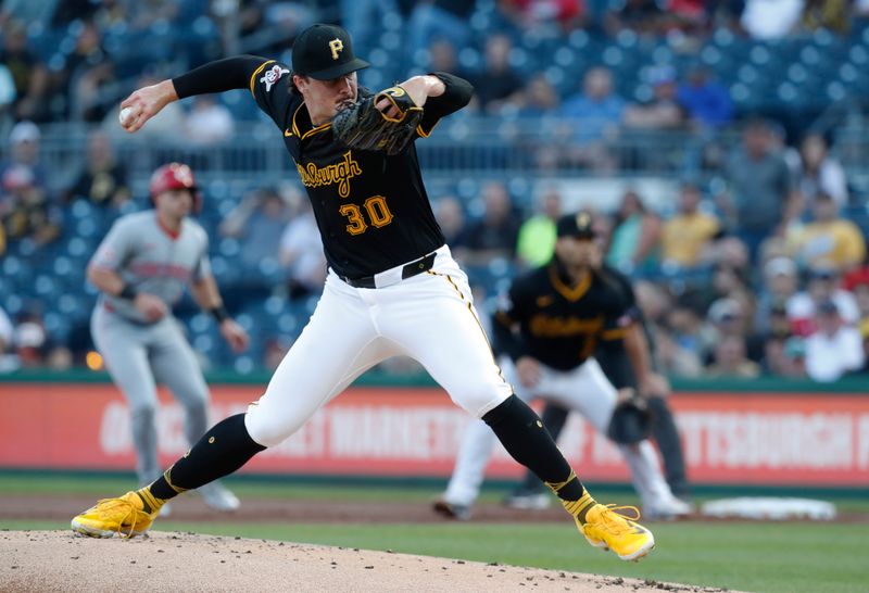 Aug 22, 2024; Pittsburgh, Pennsylvania, USA;  Pittsburgh Pirates starting pitcher Paul Skenes (30) delivers a pitch against the Cincinnati Reds during the first inning at PNC Park. Mandatory Credit: Charles LeClaire-USA TODAY Sports