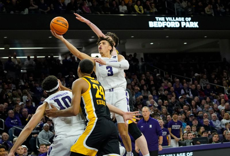 Feb 19, 2023; Evanston, Illinois, USA; Northwestern Wildcats guard Ty Berry (3) shoots over Iowa Hawkeyes forward Kris Murray (24) during the second half at Welsh-Ryan Arena. Mandatory Credit: David Banks-USA TODAY Sports