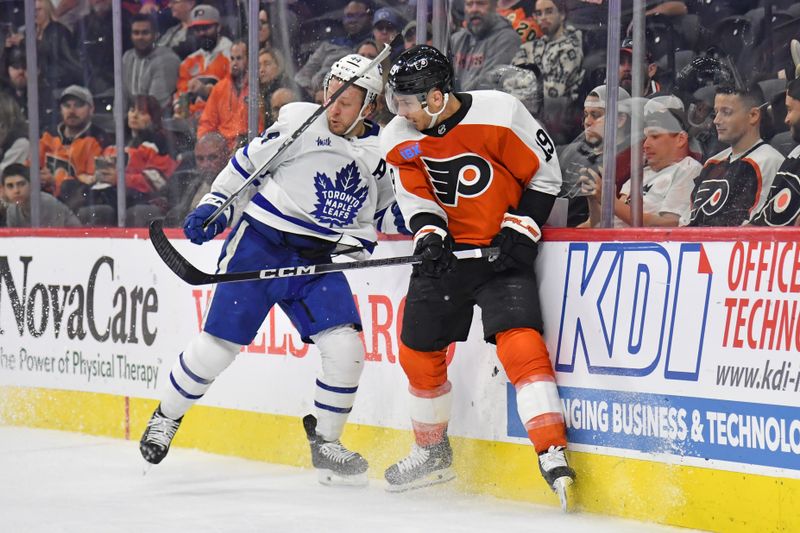 Mar 14, 2024; Philadelphia, Pennsylvania, USA; Toronto Maple Leafs defenseman Morgan Rielly (44) is checked by Philadelphia Flyers right wing Garnet Hathaway (19) during the third period at Wells Fargo Center. Mandatory Credit: Eric Hartline-USA TODAY Sports