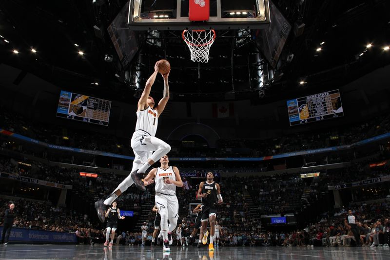 MEMPHIS, TN - APRIL 14: Michael Porter Jr. #1 of the Denver Nuggets drives to the basket during the game against the Memphis Grizzlies on April 14, 2024 at FedExForum in Memphis, Tennessee. NOTE TO USER: User expressly acknowledges and agrees that, by downloading and or using this photograph, User is consenting to the terms and conditions of the Getty Images License Agreement. Mandatory Copyright Notice: Copyright 2024 NBAE (Photo by Joe Murphy/NBAE via Getty Images)