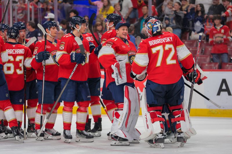 Apr 8, 2025; Sunrise, Florida, USA; Florida Panthers goaltender Vitek Vanecek (41) celebrates with goaltender Sergei Bobrovsky (72) after the game against the Toronto Maple Leafs at Amerant Bank Arena. Mandatory Credit: Sam Navarro-Imagn Images