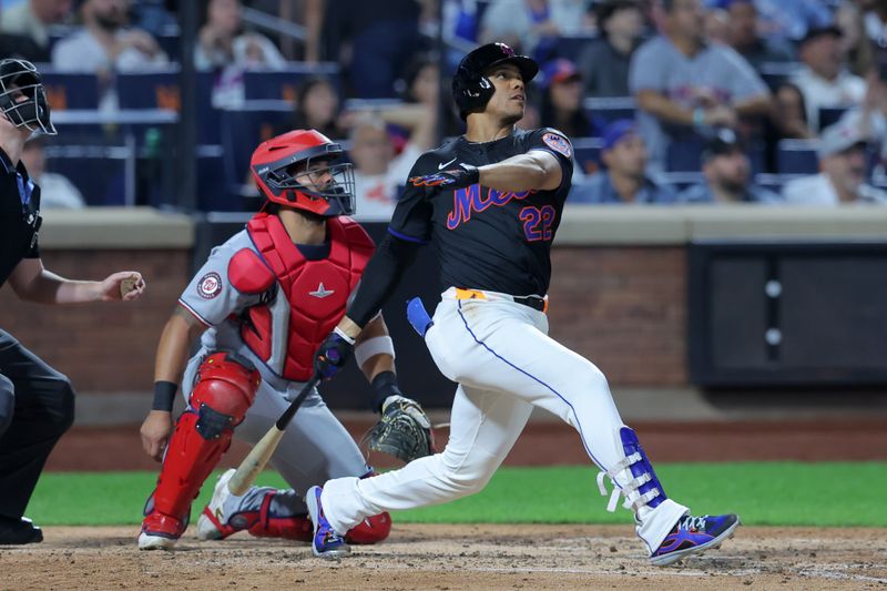 Sep 19, 2025; New York City, New York, USA; New York Mets right fielder Juan Soto (22) follows through on a three run home run against the Washington Nationals during the fourth inning at Citi Field. Mandatory Credit: Brad Penner-Imagn Images