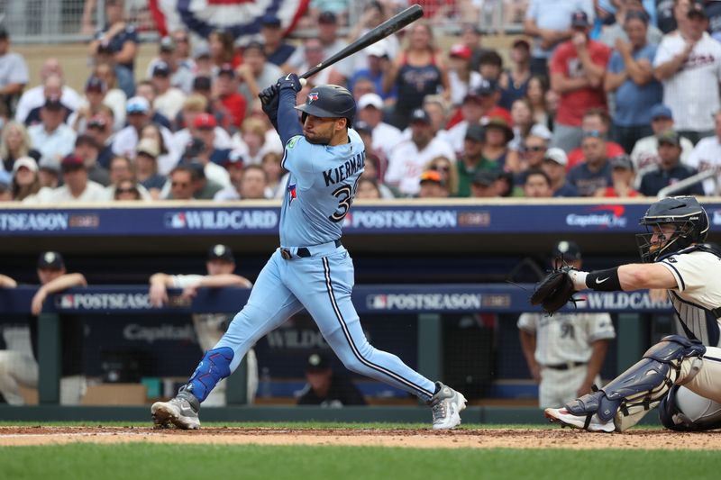 Oct 3, 2023; Minneapolis, Minnesota, USA; Toronto Blue Jays center fielder Kevin Kiermaier (39) hits RBI single in the sixth inning against the Minnesota Twins during game one of the Wildcard series for the 2023 MLB playoffs at Target Field. Mandatory Credit: Jesse Johnson-USA TODAY Sports