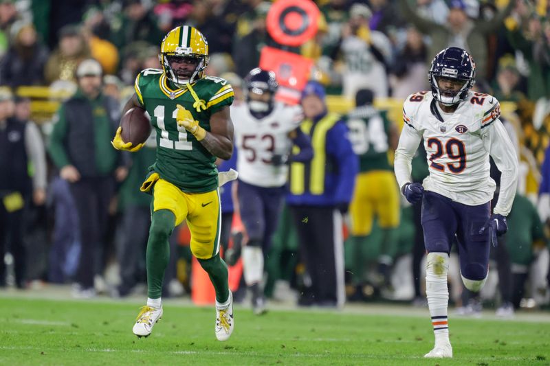 Green Bay Packers wide receiver Jayden Reed (11) runs after making a catch during an NFL football game between the Green Bay Packers and Chicago Bears Sunday, Jan. 7, 2024, in Green Bay, Wis. (AP Photo/Matt Ludtke)