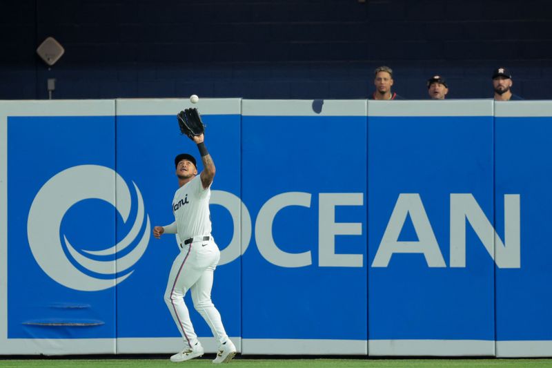 Aug 4, 2025; Miami, Florida, USA; Miami Marlins right fielder Dane Myers (54) catches a fly ball to retire Houston Astros left fielder Jesus Sanchez (not pictured) during the first inning at loanDepot Park. Mandatory Credit: Sam Navarro-Imagn Images