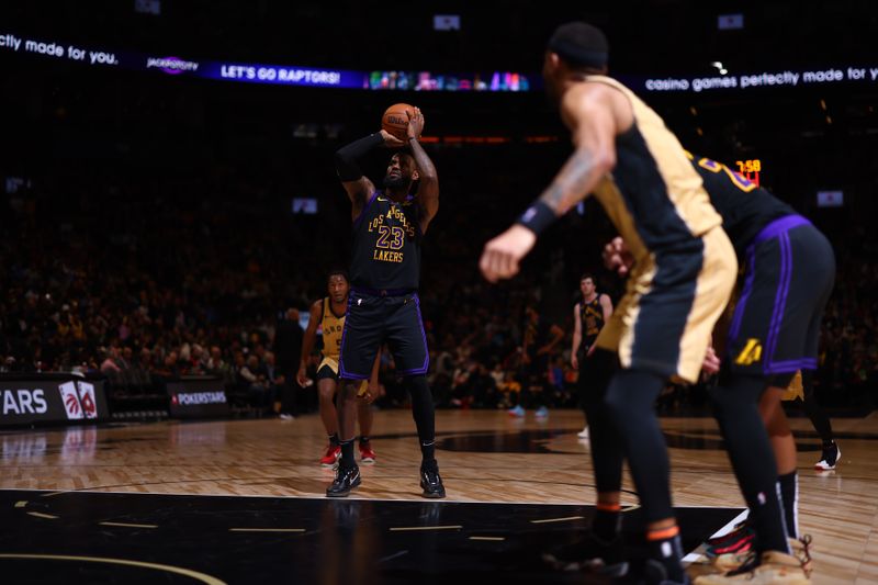 TORONTO, CANADA - APRIL 2: LeBron James #23 of the Los Angeles Lakers shoots the ball during the game against the Toronto Raptors on April 2, 2024 at the Scotiabank Arena in Toronto, Ontario, Canada.  NOTE TO USER: User expressly acknowledges and agrees that, by downloading and or using this Photograph, user is consenting to the terms and conditions of the Getty Images License Agreement.  Mandatory Copyright Notice: Copyright 2023 NBAE (Photo by Vaughn Ridley/NBAE via Getty Images)