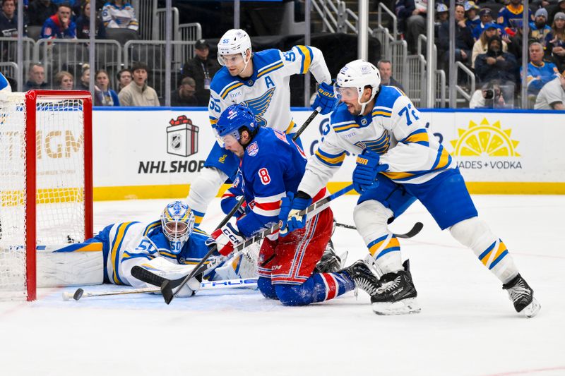 Dec 18, 2025; St. Louis, Missouri, USA; St. Louis Blues goaltender Jordan Binnington (50) defenseman Colton Parayko (55) and defenseman Justin Faulk (72) defends the net against New York Rangers left wing J.T. Miller (8) during the third period at Enterprise Center. Mandatory Credit: Jeff Curry-Imagn Images