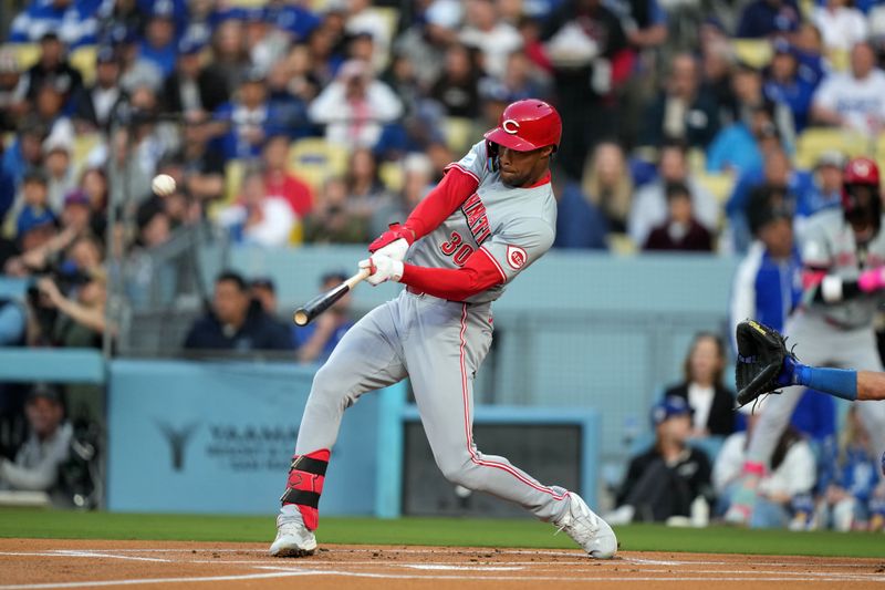 May 16, 2024; Los Angeles, California, USA; Cincinnati Reds center fielder Will Benson (30) hits a home run in the first inning against the Los Angeles Dodgers at Dodger Stadium. Mandatory Credit: Kirby Lee-USA TODAY Sports