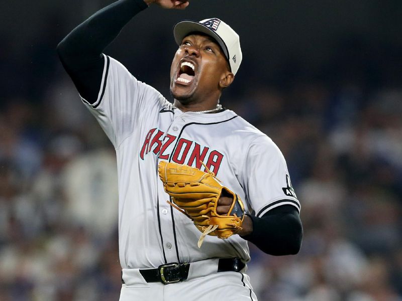 Jul 4, 2024; Los Angeles, California, USA; Arizona Diamondbacks pitcher Thyago Vieira (49) reacts after a strikeout to end the game against the Los Angeles Dodgers at Dodger Stadium. Mandatory Credit: Jason Parkhurst-USA TODAY Sports