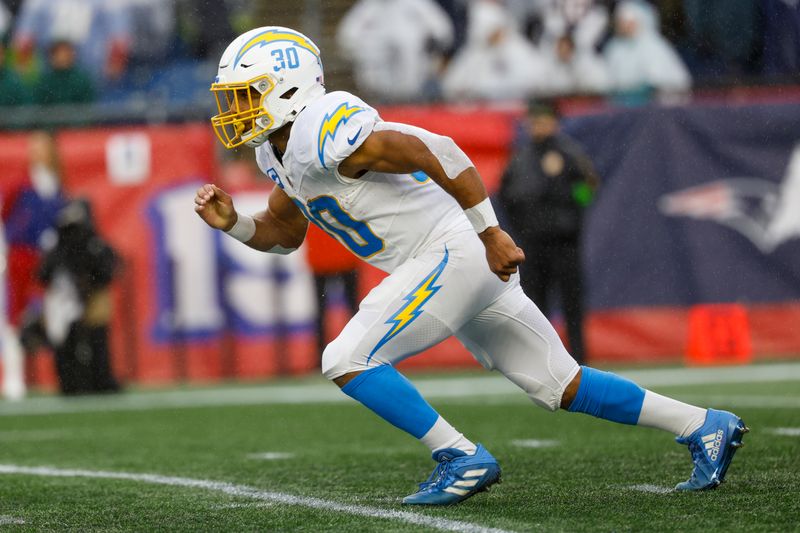 Los Angeles Chargers running back Austin Ekeler (30) runs a route during the first half of an NFL football game against the New England Patriots on Sunday, Dec. 3, 2023, in Foxborough, Mass. (AP Photo/Greg M. Cooper)