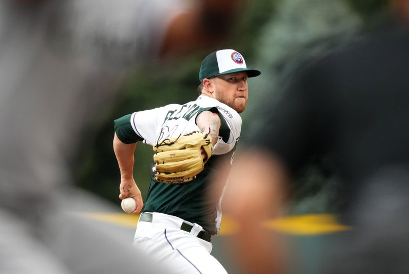 Aug 19, 2023; Denver, Colorado, USA; Colorado Rockies starting pitcher Kyle Freeland (21) delivers a pitch in the first inning against the Chicago White Sox at Coors Field. Mandatory Credit: Ron Chenoy-USA TODAY Sports