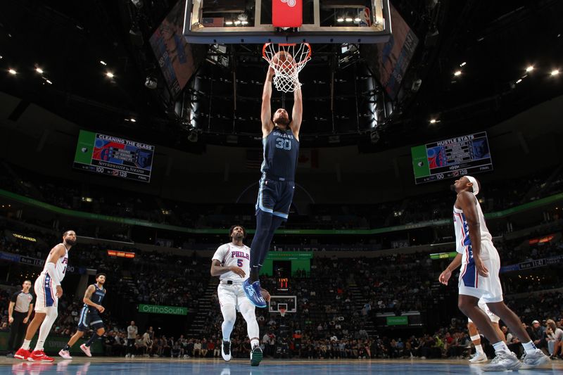 MEMPHIS, TN - NOVEMBER 22: Jay Huff #30 of the Memphis Grizzlies dunks the ball during the game against the Philadelphia 76ers on November 22, 2024 at FedExForum in Memphis, Tennessee. NOTE TO USER: User expressly acknowledges and agrees that, by downloading and or using this photograph, User is consenting to the terms and conditions of the Getty Images License Agreement. Mandatory Copyright Notice: Copyright 2024 NBAE (Photo by Joe Murphy/NBAE via Getty Images)