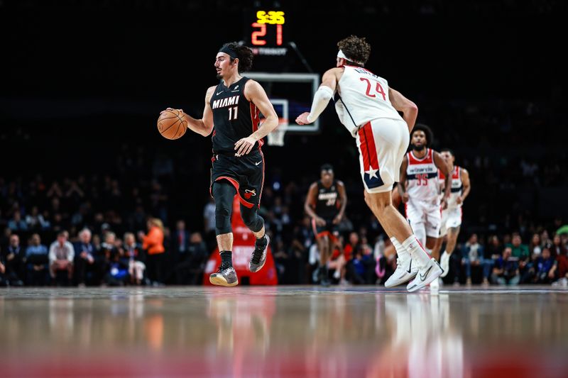 MEXICO CITY, MEXICO - NOVEMBER 02: Jaime Jaquez Jr. #11 of the Miami Heat drives against Corey Kispert #24 of the Washington Wizards during the second half of the game at Arena Ciudad de Mexico on November 02, 2024 in Mexico City, Mexico. NOTE TO USER: User expressly acknowledges and agrees that, by downloading and or using this photograph, User is consenting to the terms and conditions of the Getty Images License Agreement. (Photo by Manuel Velasquez/Getty Images)