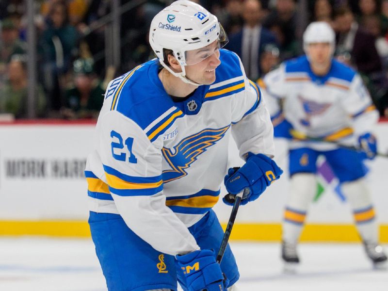Mar 1, 2026; Saint Paul, Minnesota, USA; St. Louis Blues right wing Jimmy Snuggerud (21) shoots against the Minnesota Wild in the first period at Grand Casino Arena. Mandatory Credit: Matt Blewett-Imagn Images