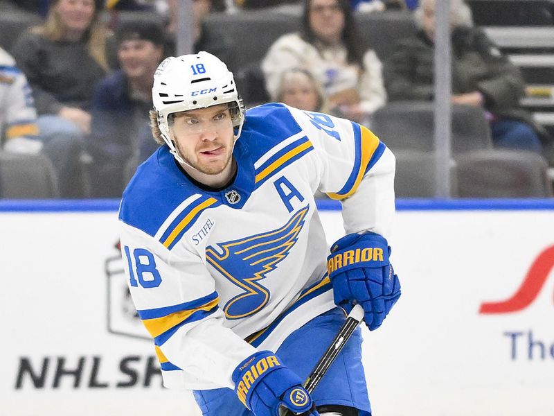 Dec 18, 2025; St. Louis, Missouri, USA; St. Louis Blues center Robert Thomas (18) controls the puck against the New York Rangers during the second period at Enterprise Center. Mandatory Credit: Jeff Curry-Imagn Images
