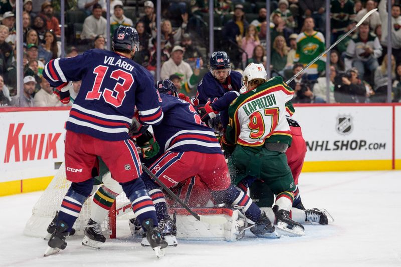 Oct 28, 2025; Saint Paul, Minnesota, USA; Minnesota Wild left wing Kirill Kaprizov (97) scores as players crash the Winnipeg Jets net in the second period at Grand Casino Arena. Mandatory Credit: Matt Blewett-Imagn Images