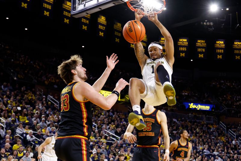 Jan 2, 2026; Ann Arbor, Michigan, USA;  Michigan Wolverines guard Roddy Gayle Jr. (11) dunks on Southern California Trojans forward Jaden Brownell (33) in the first half at Crisler Center. Mandatory Credit: Rick Osentoski-Imagn Images