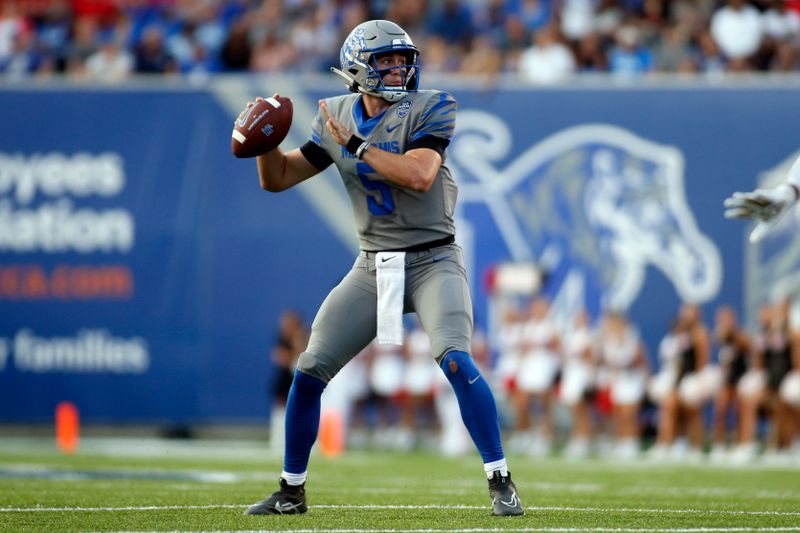 Sep 17, 2022; Memphis, Tennessee, USA; Memphis Tigers quarterback Seth Henigan (5) passes the ball during the first half against the Arkansas State Red Wolves at Liberty Bowl Memorial Stadium. Mandatory Credit: Petre Thomas-USA TODAY Sports