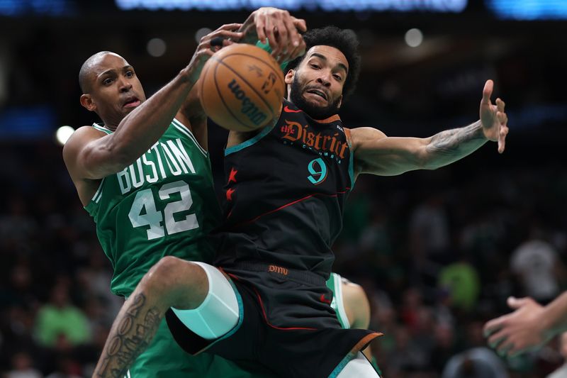 WASHINGTON, DC - MARCH 17: Justin Champagnie #9 of the Washington Wizards and Al Horford #42 of the Boston Celtics battle for a rebound during the first half at Capital One Arena on March 17, 2024 in Washington, DC. NOTE TO USER: User expressly acknowledges and agrees that, by downloading and or using this photograph, User is consenting to the terms and conditions of the Getty Images License Agreement.  (Photo by Patrick Smith/Getty Images)