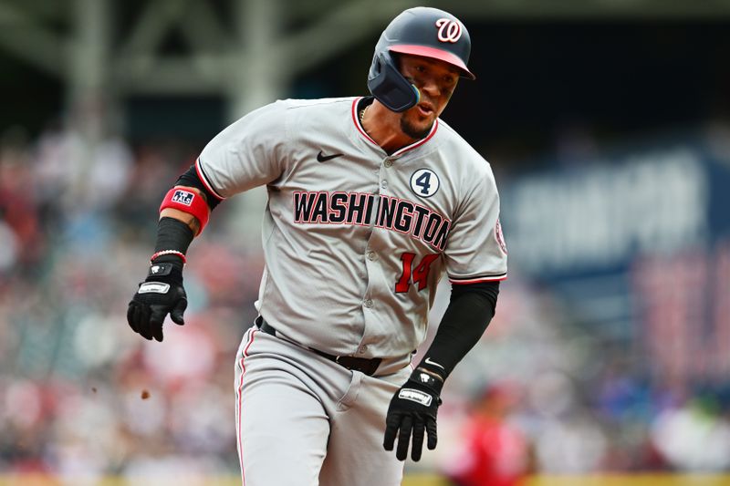Jun 2, 2024; Cleveland, Ohio, USA; Washington Nationals shortstop Ildemaro Vargas (14) rounds third base en route to scoring during the second inning against the Cleveland Guardians at Progressive Field. Mandatory Credit: Ken Blaze-USA TODAY Sports