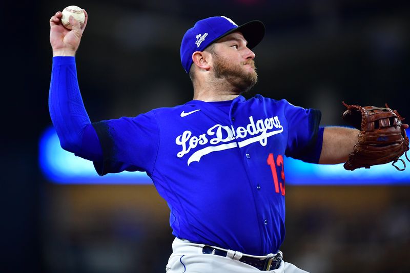 Jul 6, 2023; Los Angeles, California, USA; Los Angeles Dodgers third baseman Max Muncy (13) throws to first for the out against Pittsburgh Pirates catcher Henry Davis (32) during the ninth inning at Dodger Stadium. Mandatory Credit: Gary A. Vasquez-USA TODAY Sports