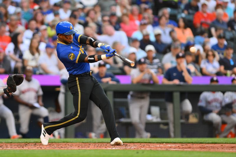 Jul 19, 2024; Seattle, Washington, USA; Seattle Mariners right fielder Victor Robles (10) hits a single against the Houston Astros during the third inning at T-Mobile Park. Mandatory Credit: Steven Bisig-USA TODAY Sports