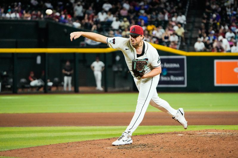 Jun 28, 2025; Phoenix, Arizona, USA; Arizona Diamondbacks relief pitcher Kevin Ginkel (37) delivers a pitch against the Miami Marlins in the seventh inning at Chase Field. Mandatory Credit: Arianna Grainey-Imagn Images