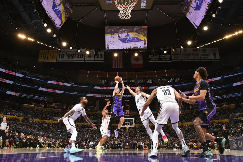 LOS ANGELES, CA - JANUARY 17:  Austin Reaves #15 of the Los Angeles Lakers shoots the ball during the game against the Brooklyn Nets on January 17, 2025 at Crypto.Com Arena in Los Angeles, California. NOTE TO USER: User expressly acknowledges and agrees that, by downloading and/or using this Photograph, user is consenting to the terms and conditions of the Getty Images License Agreement. Mandatory Copyright Notice: Copyright 2025 NBAE (Photo by Adam Pantozzi/NBAE via Getty Images)