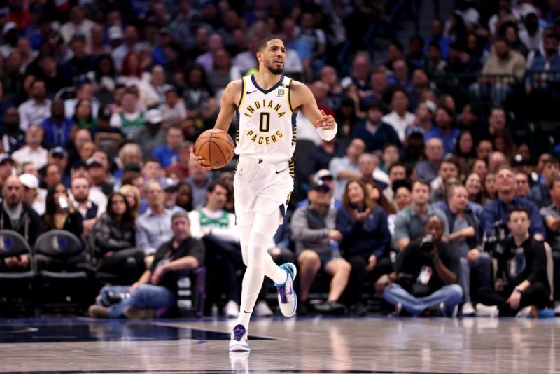 DALLAS, TEXAS - MARCH 05: Tyrese Haliburton #0 of the Indiana Pacers dribbles the ball up court against the Dallas Mavericks at American Airlines Center on March 05, 2024 in Dallas, Texas. NOTE TO USER: User expressly acknowledges and agrees that, by downloading and or using this photograph, User is consenting to the terms and conditions of the Getty Images License Agreement. (Photo by Tim Heitman/Getty Images)