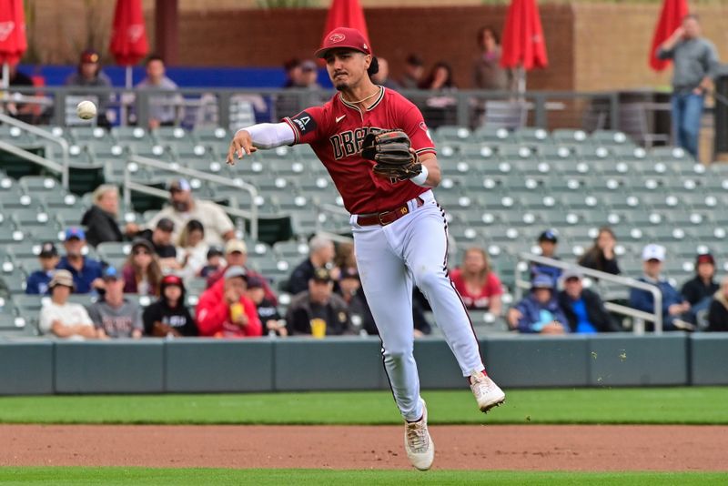 Mar 21, 2023; Salt River Pima-Maricopa, Arizona, USA; Arizona Diamondbacks third baseman Josh Rojas (10) throws to first base in the first inning against the Los Angeles Angels during a Spring Training game at Salt River Fields at Talking Stick. Mandatory Credit: Matt Kartozian-USA TODAY Sports