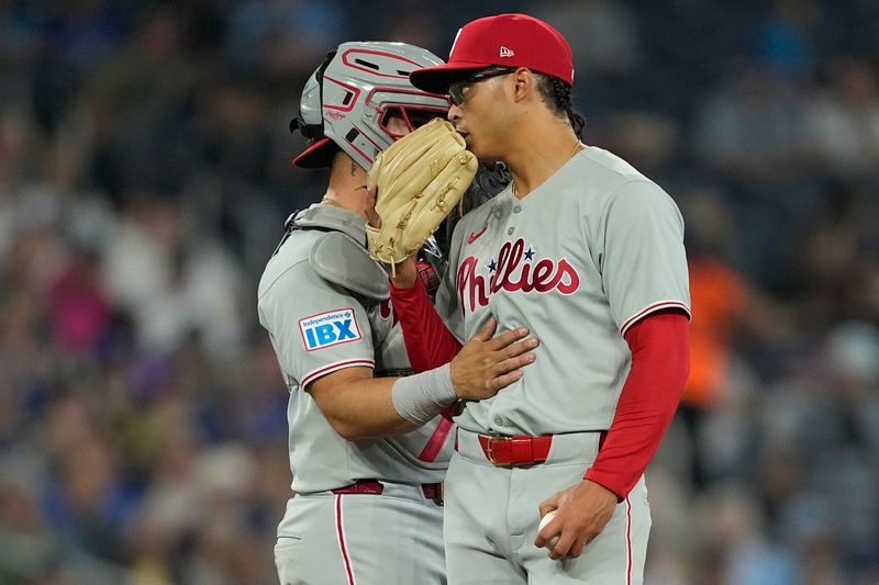 Jun 5, 2025; Toronto, Ontario, CAN; Philadelphia Phillies catcher Rafael Marchan (13) talks with starting pitcher Jesus Luzardo (44) during the third inning against the Toronto Blue Jays at Rogers Centre. Mandatory Credit: John E. Sokolowski-Imagn Images