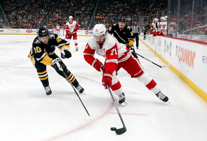 Apr 11, 2024; Pittsburgh, Pennsylvania, USA; Detroit Red Wings center Dylan Larkin (71) skates with the puck as Pittsburgh Penguins center Lars Eller (20) chases during the second period at PPG Paints Arena. Mandatory Credit: Charles LeClaire-USA TODAY Sports