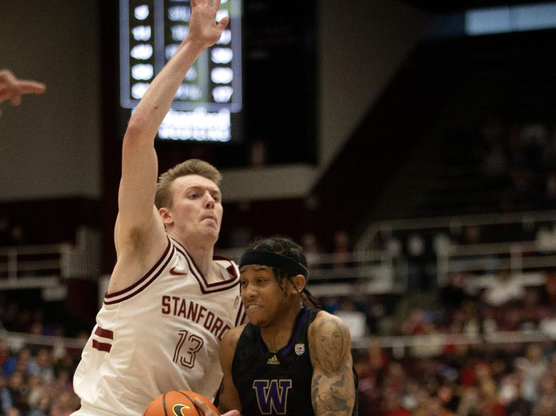 Feb 26, 2023; Stanford, California, USA; Washington Huskies guard Koren Johnson (0) drives past Stanford Cardinal guard Michael Jones (13) during the second half at Maples Pavilion. Mandatory Credit: D. Ross Cameron-USA TODAY Sports