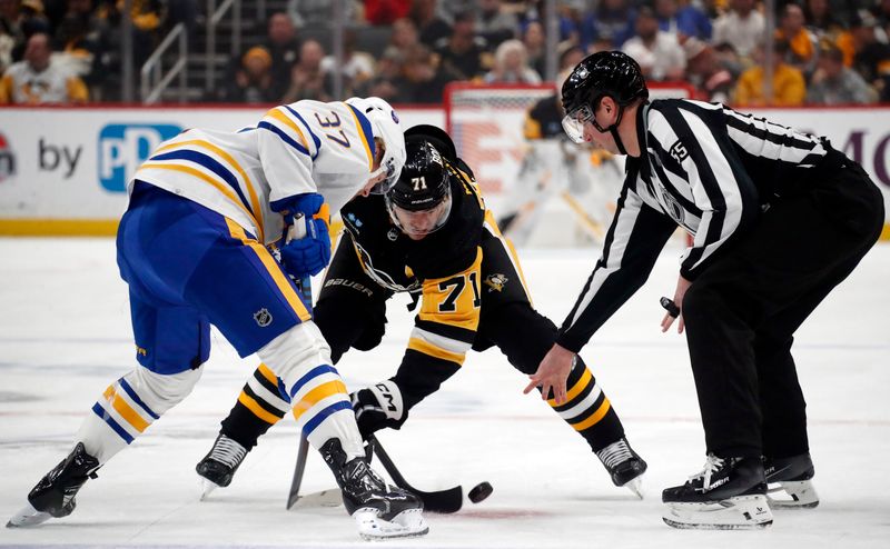 Jan 6, 2024; Pittsburgh, Pennsylvania, USA;  Buffalo Sabres center Casey Mittelstadt (37) and Pittsburgh Penguins center Evgeni Malkin (71) take a face-off during the first period at PPG Paints Arena. Mandatory Credit: Charles LeClaire-USA TODAY Sports