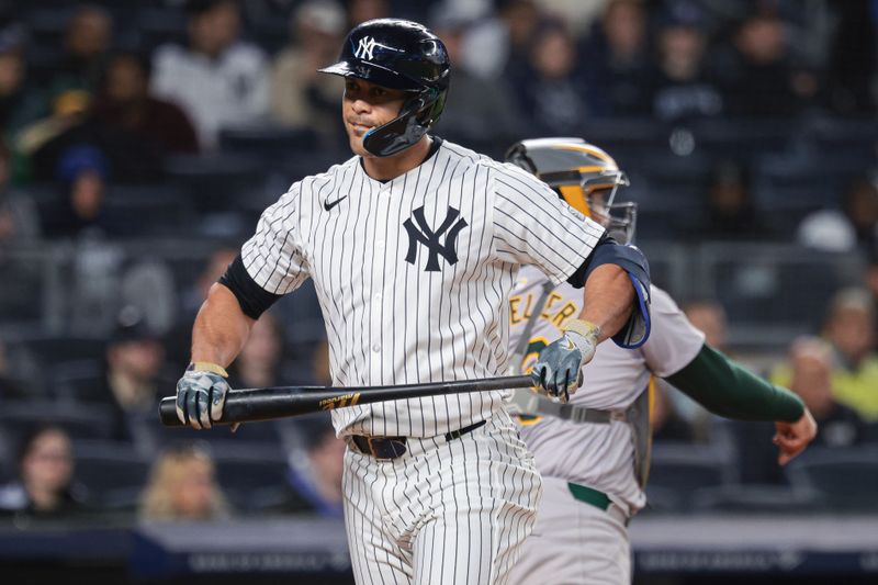 Apr 23, 2024; Bronx, New York, USA; New York Yankees designated hitter Giancarlo Stanton (27) reacts after striking out during the sixth inning against the Oakland Athletics  at Yankee Stadium. Mandatory Credit: Vincent Carchietta-USA TODAY Sports