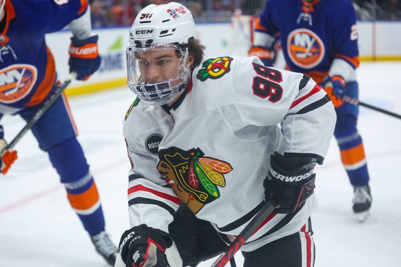 Apr 2, 2024; Elmont, New York, USA; Chicago Blackhawks center Connor Bedard (98) track the puck against the New York Islanders during the third period at UBS Arena. Mandatory Credit: Thomas Salus-USA TODAY Sports