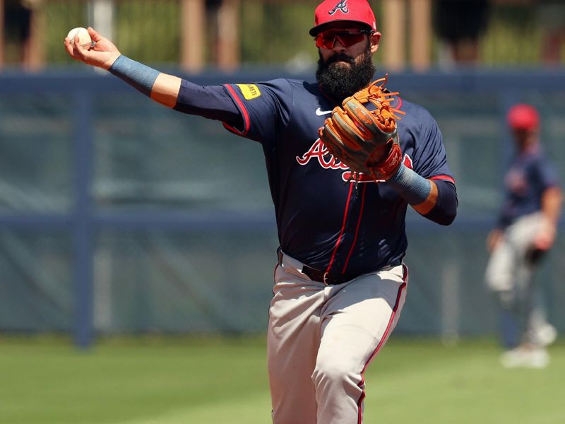 Mar 18, 2024; Port Charlotte, Florida, USA;  Atlanta Braves second baseman Luis Guillorme (15)  throws the ball to first base for a double play during the second inning at Charlotte Sports Park. Mandatory Credit: Kim Klement Neitzel-USA TODAY Sports