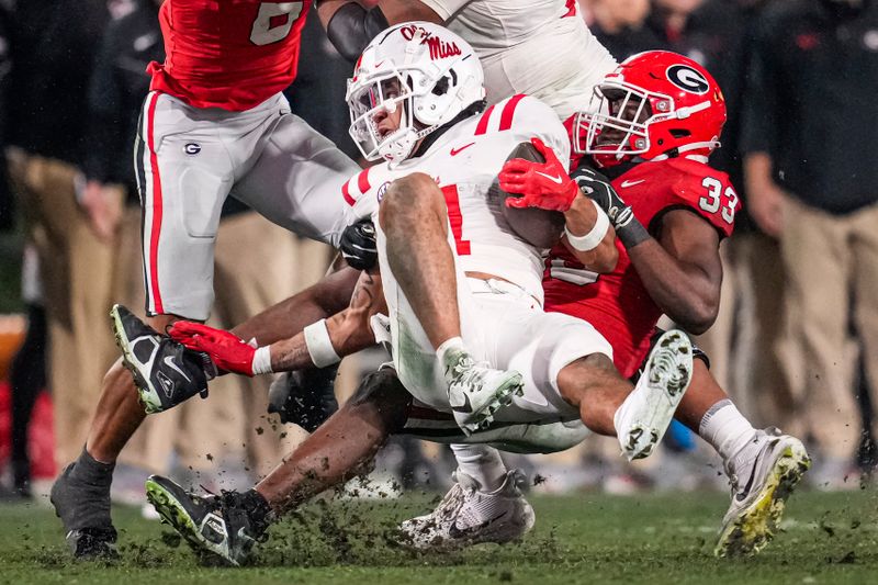 Nov 11, 2023; Athens, Georgia, USA; A Mississippi Rebels wide receiver Jordan Watkins (11) is tackled by Georgia Bulldogs linebacker C.J. Allen (33) during the second half at Sanford Stadium. Mandatory Credit: Dale Zanine-USA TODAY Sports