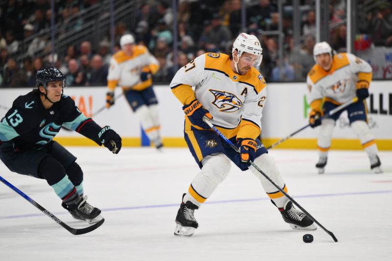 Mar 16, 2024; Seattle, Washington, USA; Nashville Predators defenseman Ryan McDonagh (27) plays the puck during the second period against the Seattle Kraken at Climate Pledge Arena. Mandatory Credit: Steven Bisig-USA TODAY Sports