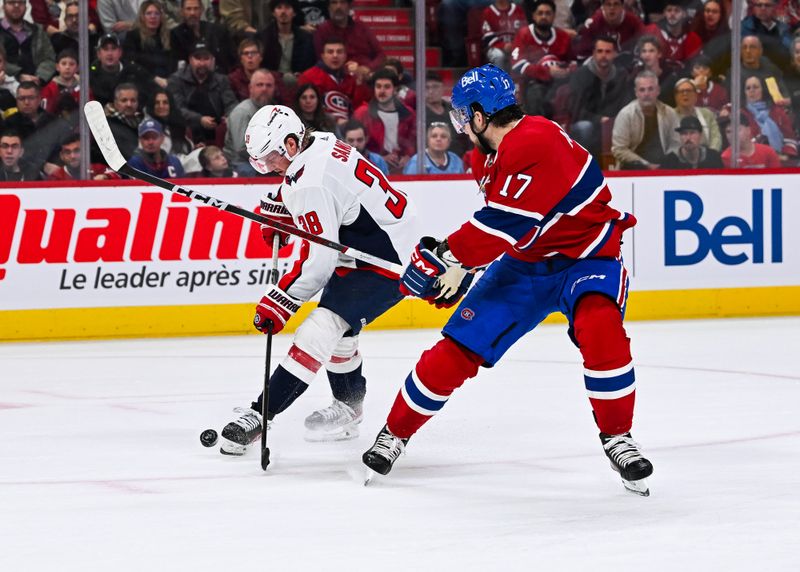 Oct 21, 2023; Montreal, Quebec, CAN; Washington Capitals defenseman Rasmus Sandin (38) steals the puck from Montreal Canadiens right wing Josh Anderson (17) during the second period at Bell Centre. Mandatory Credit: David Kirouac-USA TODAY Sports