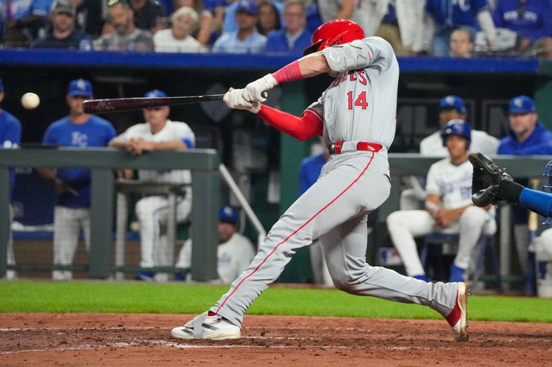 Aug 20, 2024; Kansas City, Missouri, USA; Los Angeles Angels catcher Logan O'Hoppe (14) hits a one-run single against the Kansas City Royals in the sixth inning at Kauffman Stadium. Mandatory Credit: Denny Medley-USA TODAY Sports