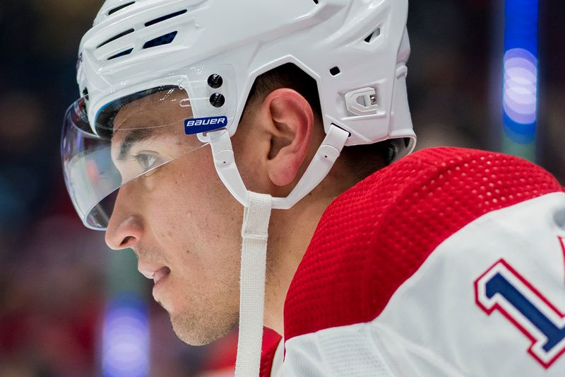 Mar 21, 2024; Vancouver, British Columbia, CAN; Montreal Canadiens forward Nick Suzuki (14) rests during warm up prior to a game against the Vancouver Canucks at Rogers Arena. Mandatory Credit: Bob Frid-USA TODAY Sports